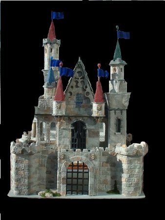 CDHM Artisan Tracy Topps of Minis On The Edge creates paper clay dollhouses in 1:12, 1:24, 1:48 and even 144 scale dollhouse kits.  Finishing the dollhouses in the style of the old european castles, and victorian styles of england, you america