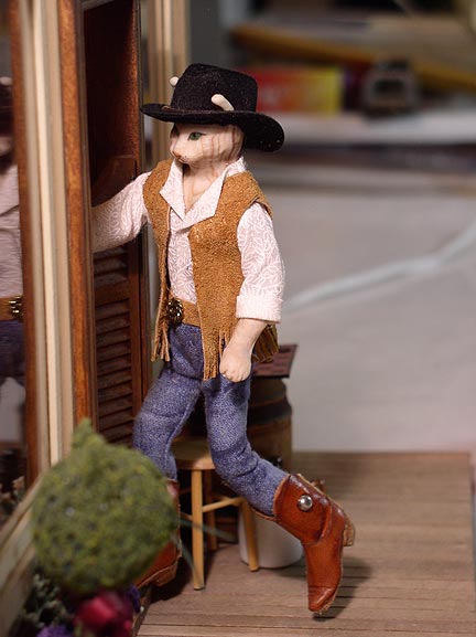 CDHM Artisan Deborah Mackie of Whitehorse Studio hand sculpted this cowboy doll in dollhouse miniature scale, 1:12