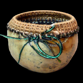 OOAK 1:12 scale Tennessee Spinner Gourd, rimmed using a traditional closed coiling technique, where a core of fine river cane is totally wrapped and stitched basket. OOAK collector's piece, not a child's toy. Gourd baskt is signed on the bottom and measures approximately 1.5 inch wide by 1 inch tall by CDHM Artisan Monica Graham, IGMA Artisan, of M-M-Minis
