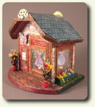 CDHM artisan Pat Carlson creating under the business name of Pat Carlson Miniature creates dollhouse miniature fairy dress boutique in 144 scale