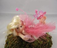 CDHM artisan Deborah Rivera sculpts with polymer clay fairies and dolls in 1/12 scale