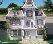 CDHM artisan Tracy Topps of Minis On The Edge Miniatues created this dollhouse 1:12 scale with paperclay features