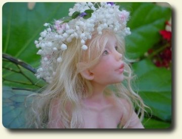 CDHM artisan Judy A. Raley created child fairy, handmade sculpted and dressed in dollhouse scale