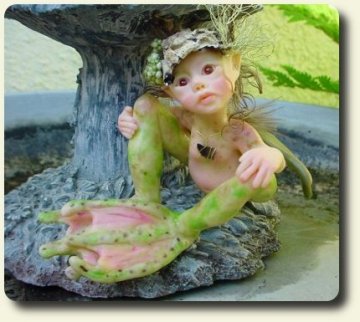 CDHM artisan Judy A. Raley created this handmade sculpted and dressed fairy child with teddy bear in 1/12 scale dollhouse miniatures