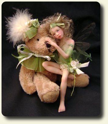 CDHM artisan Judy A. Raley created this handmade sculpted and dressed fairy child with teddy bear in 1/12 scale dollhouse miniatures