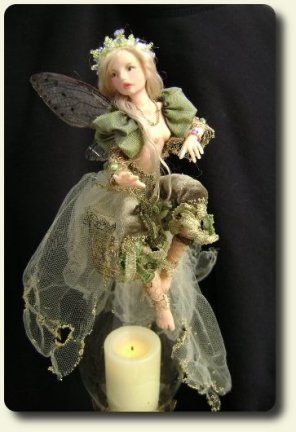 CDHM artisan Judy A. Raley created this handmade sculpted and dressed fairy child with teddy bear in 1/12 scale dollhouse miniatures