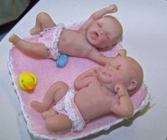 CDHM artisan Christene Jones  sculpts art dolls in 1:12 scale, including babies for the dollhouse