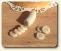 CDHM artisan Hanna Lindroth doing business as Mini Chef shows you a how-to on making peeled oranges in dollhouse 1:12 scale