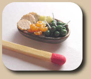 CDHM artisan Nathalie Gireaud of Provence Miniatures makes 1:12 scale foods for the dollhouse miniature collector