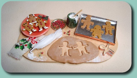 CDHM Artisan Nathalie Gireaud creates polymer clay dollhouse scale foods and dressed dolls and doll clothing in 1/12 scale
