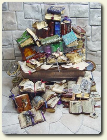 CDHM artisan Ericka Van Horn Handmade orrery and books