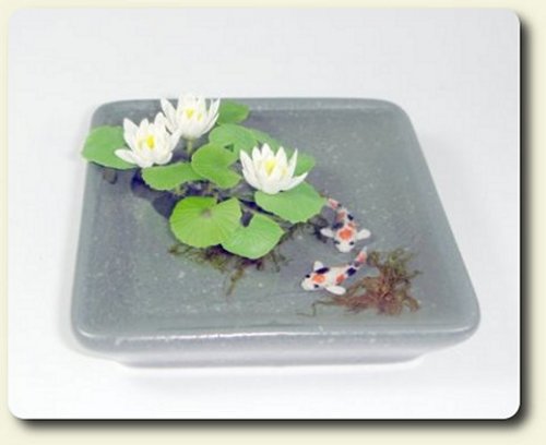 Water lilies in pond by CDHM artisan Pimsiri Sukkerd of Bee Tree Minis