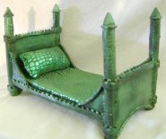 CDHM Artisan A.H. Designs has created a fantasy dolls miniature bed