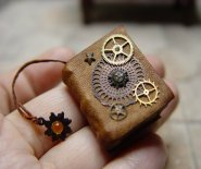 CDHM artisan Ericka VanHorn of EVMiniatures creates miniature books along with fantasy wizard pieces for 1:12 scale