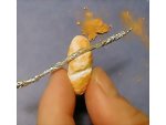 Showing bread after yellow chalk has been blushed onto the clay