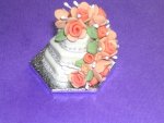 Placing wedding cake on a foiled base