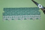 Folding the remaining edges of the fabric around the pelmet