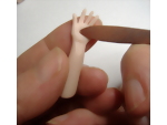 Creating detail on the palm of the dolls hand