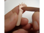Creating detail on the palm of the dolls hand