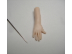 Giving detail to the fingers of the male polymer clay hand