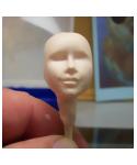 Creating the nose of the polymer clay sculpted dolls head