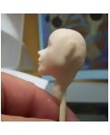 Creating the placement for the ears of the sculpted face of your doll