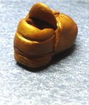 defining the top edge of the shoe.