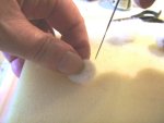 Punching the back side of the wool to create the ears