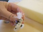 Attaching the hanky to the paw of the needle felted teddy bear