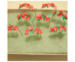 Curving and placing the petunia flowers in your dollhouse miniature container