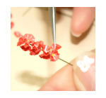 Continue adding blooms to the dollhouse miniature flower stem