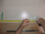 Measuring the acrylic light panel before cutting