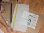 Measuring the three smaller acrylic panels for scoring