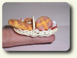 CDHM Artisan Vanesa Pizarro hand sculpted this bread in a basket for the dollhouse miniature kitchen